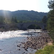 a Scottish salmon fishing river in mid summer on a sunny day with low water levels
